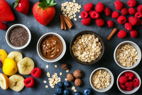 Ingredients for overnight oats with flax seeds, including oats, bananas, strawberries, raspberries, blueberries, and nut butter.